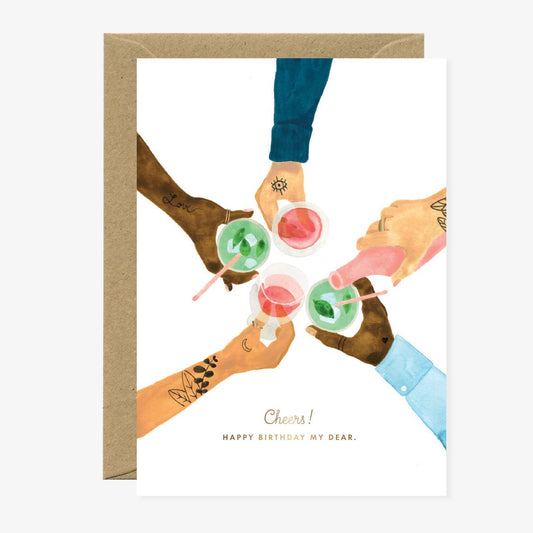 “Carte de vœux ‘Gold Cheers’ avec design doré pour célébrations, imprimée en France sur papier naturel, All The Ways To Say.”
