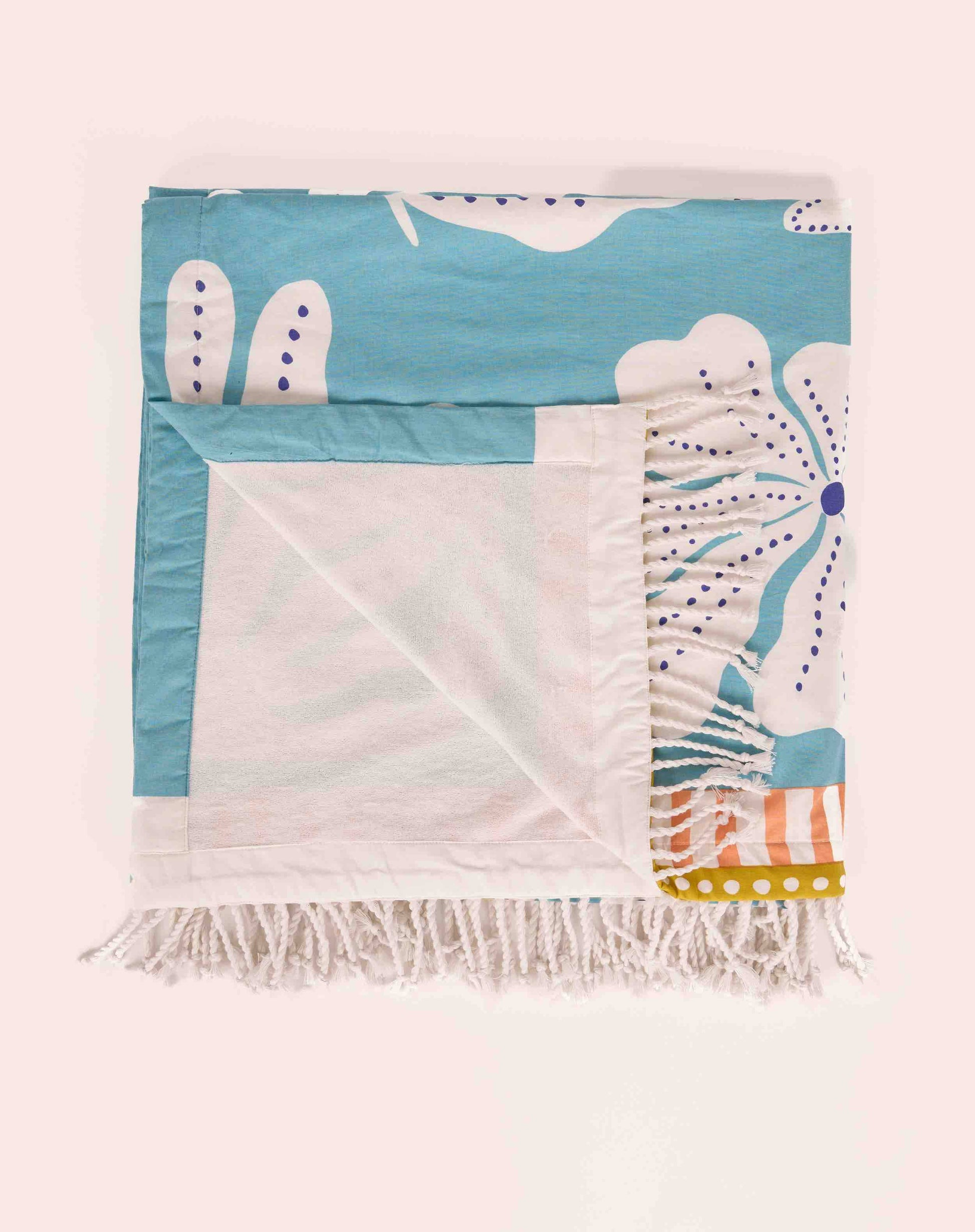 Serviette fouta 100 × 190 cm en coton imprimé et doublée en éponge, style bohème.