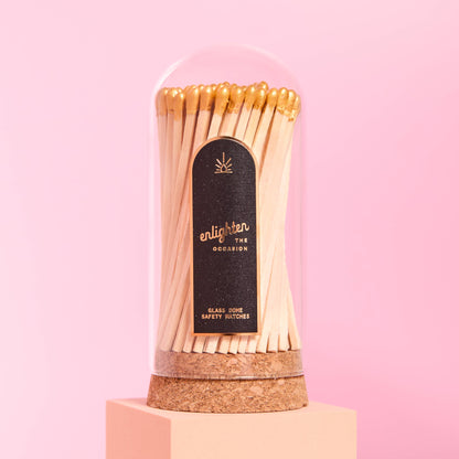 Dôme en verre avec allumettes dorées